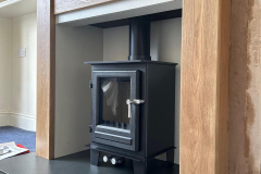 Clock compact stove